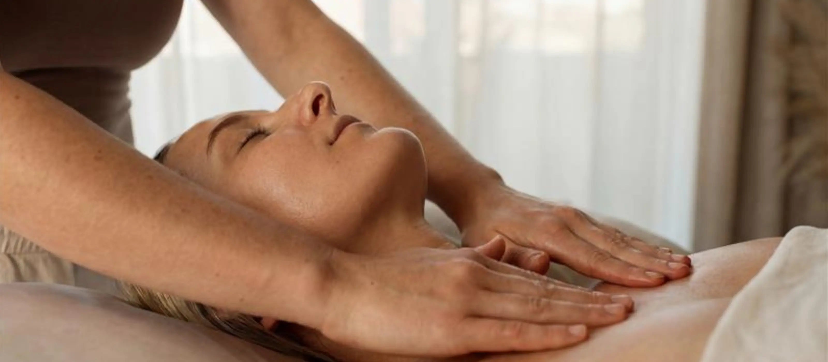 Practitioner performing gentle chest-focused Brazilian lymphatic massage on a client at Body Reset Montecito